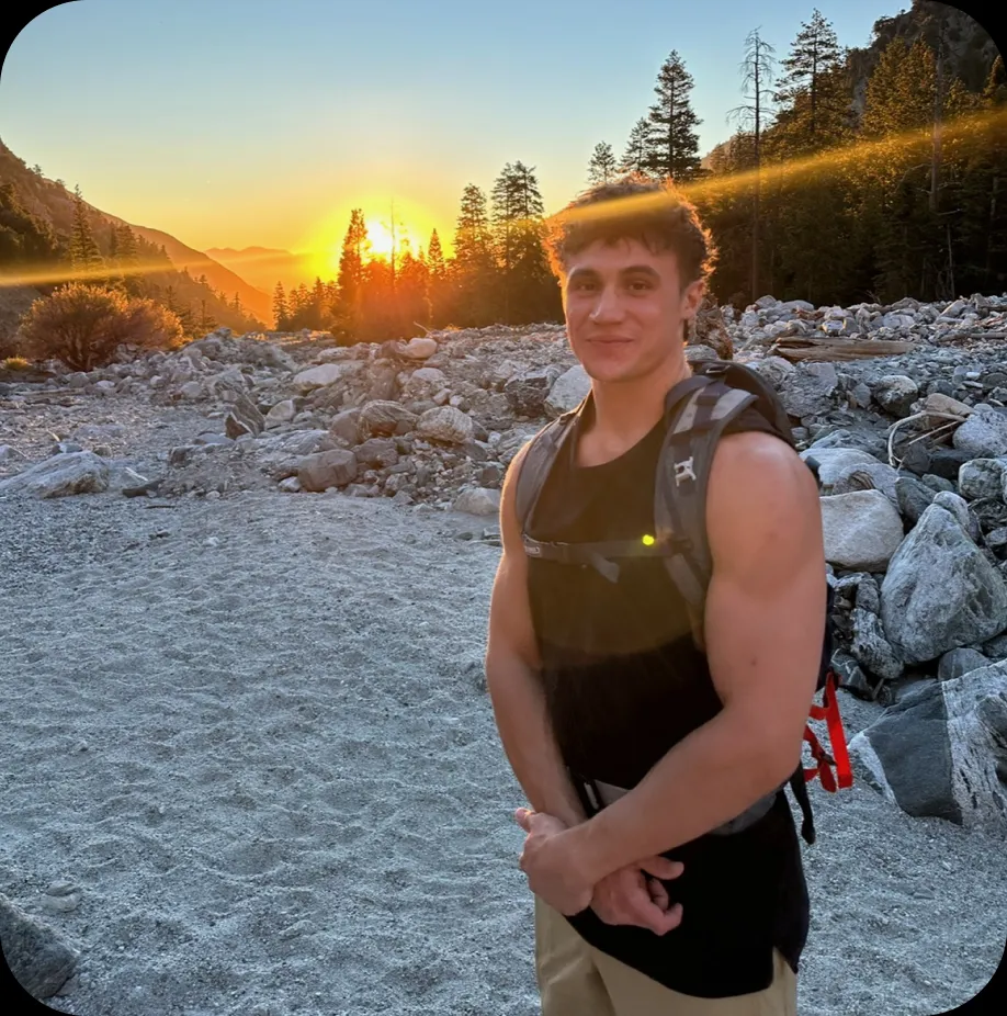 Jack, a freelance Webflow designer and developer, standing outdoors at sunset.